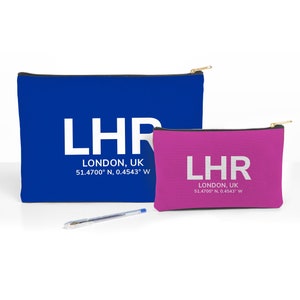 May include: Two zippered pouches, one blue and one pink, with the text "LHR LONDON, UK 51.4700° N, 0.4543° W" printed in white.