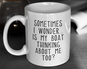 May include: White ceramic coffee mug with black text that reads "Sometimes I wonder... is my boat thinking about me too?"