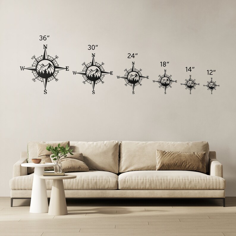 May include: A set of six black metal compass wall decor pieces with mountain silhouettes. The compasses are available in six sizes: 12 inches, 14 inches, 18 inches, 24 inches, 30 inches, and 36 inches.
