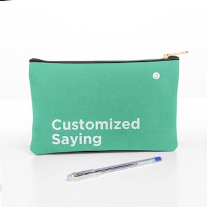 May include: A teal zippered pouch with a black zipper and a white inscription that reads "Customized Saying".