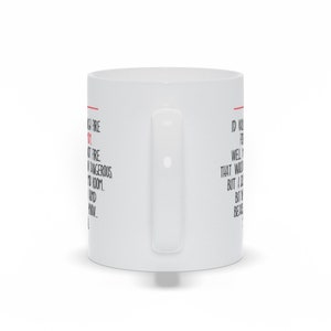 May include: White ceramic mug with a black and red text design. The text reads "VGA Fire 2, UT Fire, Dangerous, 7000, And, e" on the left side and "ID Know That Would Be Well But I So But In Because" on the right side.