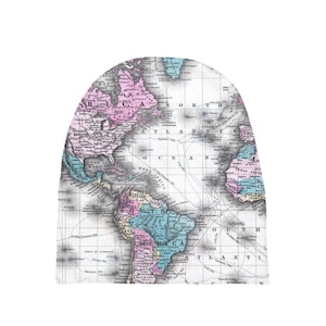 May include: An antique world map with a vintage aesthetic. The map is printed in black and white with colored borders for each continent. The map shows the continents of North America, South America, Europe, Africa, Asia, and Australia. The map is printed on a white background.