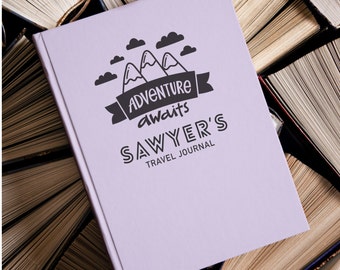 May include: Purple travel journal with the text "Adventure awaits Sawyer's Travel Journal" and a graphic of mountains and clouds.