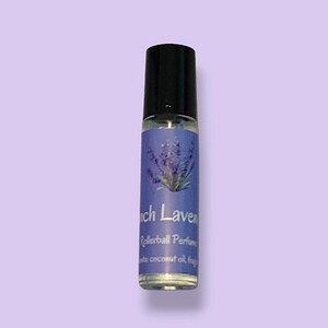 May include: A clear glass rollerball perfume bottle with a black cap. The label is blue and white with a lavender flower design and the text "French Lavender Rollerball Perfume" and "with coconut oil, fragrance".
