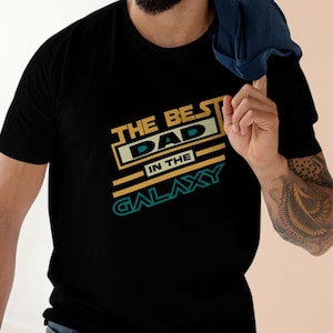 The Best Dad in the Galaxy Tee, Father&#39;s Day Gift, Dad Humor Shirt, Space Lover Apparel, Casual Dad T-Shirt