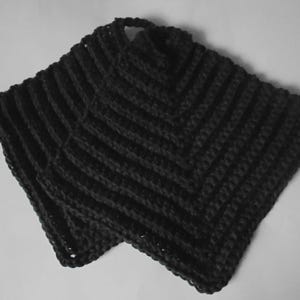 May include: Two black crocheted pot holders with a diamond pattern.