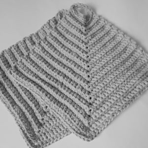 May include: Two grey crocheted pot holders with a striped pattern.