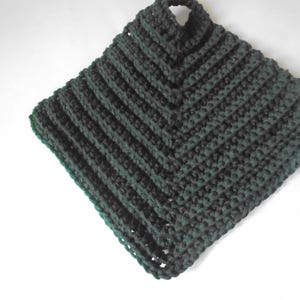 May include: A dark green crocheted pot holder with a diamond pattern.