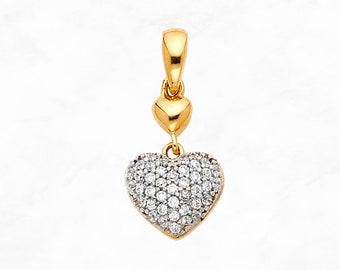 May include: A gold heart pendant with a smaller heart at the top and a larger heart covered in small clear stones.