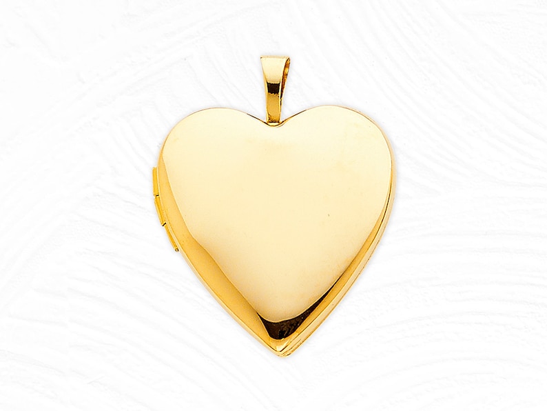 May include: A gold heart-shaped locket pendant with a hinged opening.