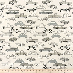 May include: A white fabric with a repeating pattern of grey and black cars, trucks, and motorcycles. The pattern is in a vintage style.