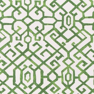 May include: Green and white geometric pattern fabric with a repeating design of interlocking squares and circles.