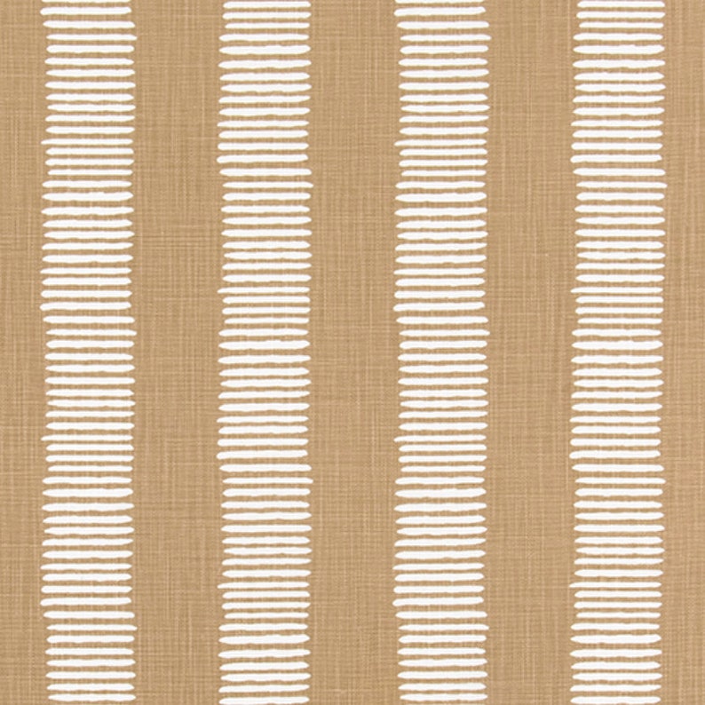 May include: A brown fabric with white stripes made of small, oval shapes. The fabric has a subtle texture.