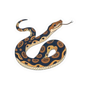 May include: A sticker depicting a stylized illustration of a snake. The snake has a brown head and a body patterned with dark blue and tan circles. Its tongue is extended, and the design has a white border.