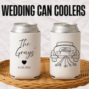 May include: Two white can coolers with silver tops. One cooler has "The Grays'" and a heart with the date 11.01.2025. The other cooler features a car with a "Just Married" banner. The words "WEDDING CAN COOLERS" are at the top.