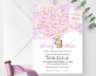 May include: A pink and white baby shower invitation with a teddy bear in a basket attached to a bunch of pink and white balloons. The text on the invitation reads "We can Bearly Wait Baby Amelia is on the way! Join us for a Baby Shower honoring Tabitha Richards Saturday, September 15 at 2PM 2104 Anywhere Road, Orlando, FL RSVP to Paula by 9/10 at 555.123.4567 Registered at Target & Amazon"
