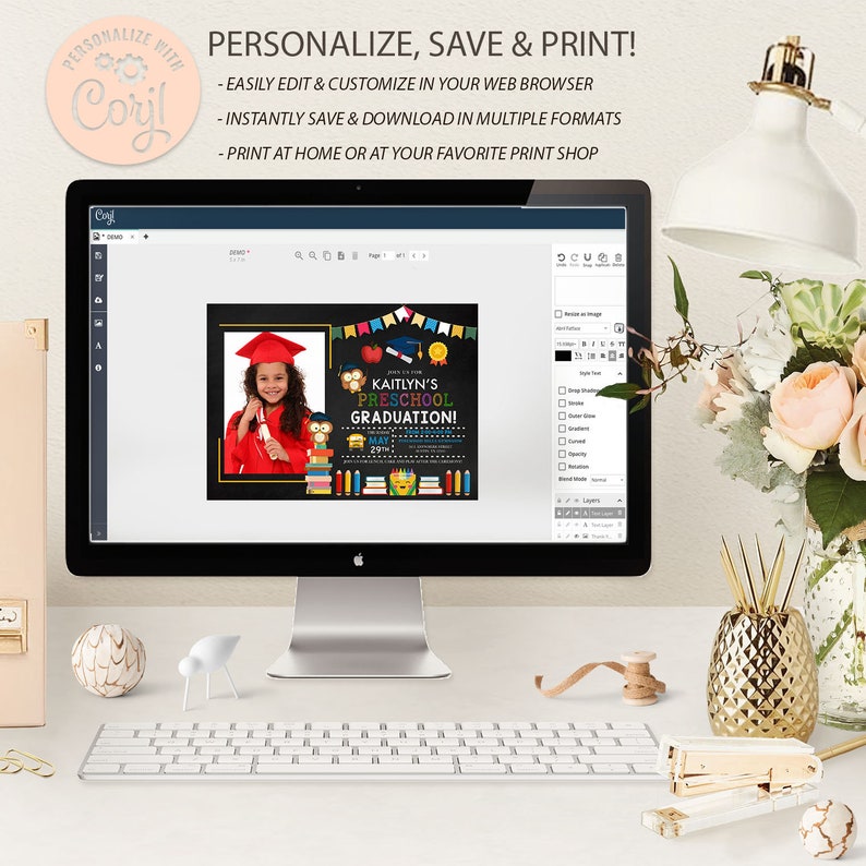 May include: A computer monitor displays a preschool graduation announcement. The announcement features a photo of a child in a graduation cap and gown, with colorful graphics and text that reads "Kaitlyn's Preschool Graduation!"