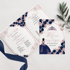 May include: A quinceañera invitation suite with a tri-fold program and a welcome card. The design features navy blue and blush pink floral arrangements, a rose gold geometric frame, and a silhouette of a girl in a gown. The text reads "Welcome to Cataleya Delgado's Quinceañera."