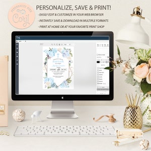 May include: A computer screen displaying a blue and white baptism invitation with gold accents. The invitation features a cross, flowers, and the text "Baptism of our daughter" and "September 28". The screen is on a desk with a keyboard, a stapler, and a vase of flowers.