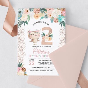 May include: A pink and white invitation with a floral design and a gold glitter background. The invitation says "Look Whooo's Turning 2" and "Olivia's Second Birthday". The date is April 22nd and the time is 12:00 PM to 3:00 PM. The RSVP information is included at the bottom.