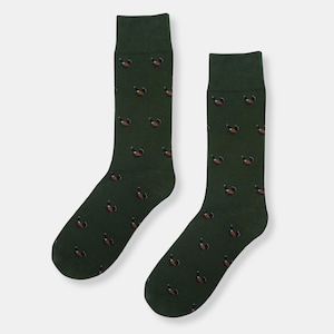 May include: A pair of green socks with a brown and black bird pattern.