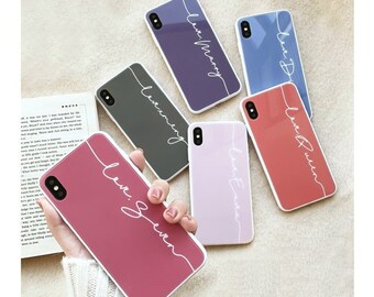 May include: Six different phone cases with white lettering on a colorful background. The cases feature the words "Love Mom", "Love Dad", "Love Queen", "Love Sister", "Love Grandma", and "Love Grandpa".