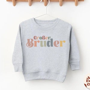 Großer Bruder-Kleinkind-Shirt, Schwangerschafts-Enthüllungsshirt, süßes Retro-Kinder-Shirt, natürliches Kleiner-Bruder-Baby-Shirt, deutsches Kinder-T-Shirt Großer Bruder Heather Gray