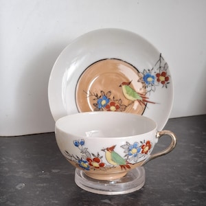 Vintage Japans theekop en schotel vogel bloemdessin eierschaalporselein