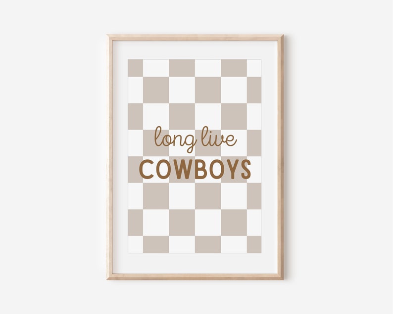 May include: A framed print with a brown and white checkered background. The text "long live cowboys" is written in brown text on the print.