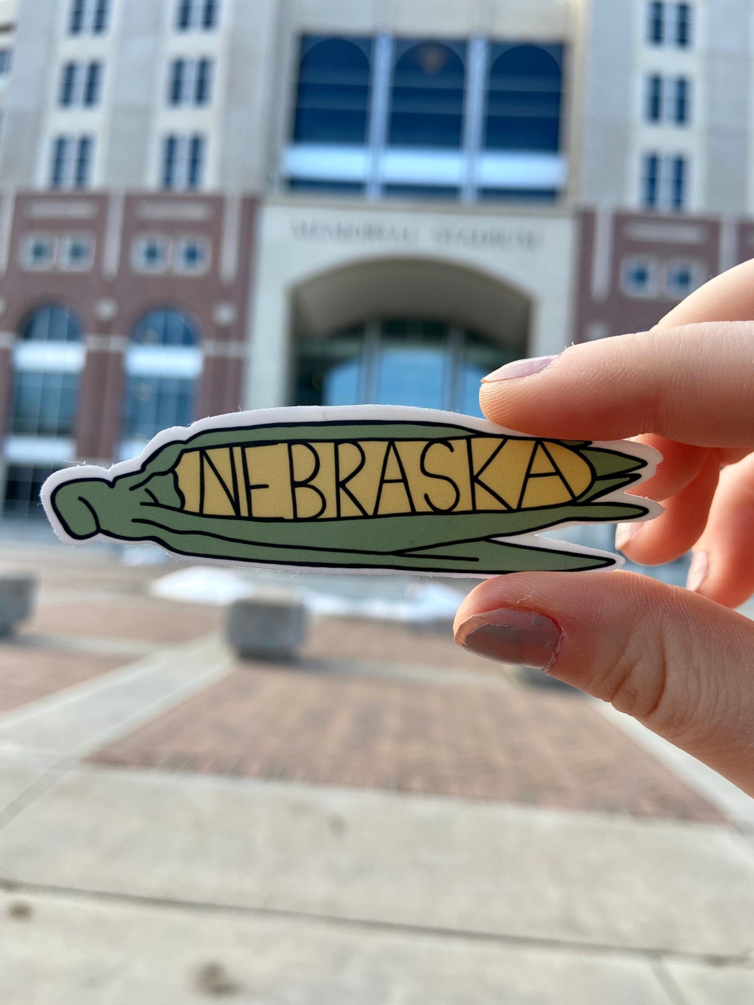 thumbnail interactive-video image 1 of Nebraska Cornhuskers Helmet Die-Cut Laminated Vinyl Sticker/Decal - Multi-Color, Made In USA 1 of 6