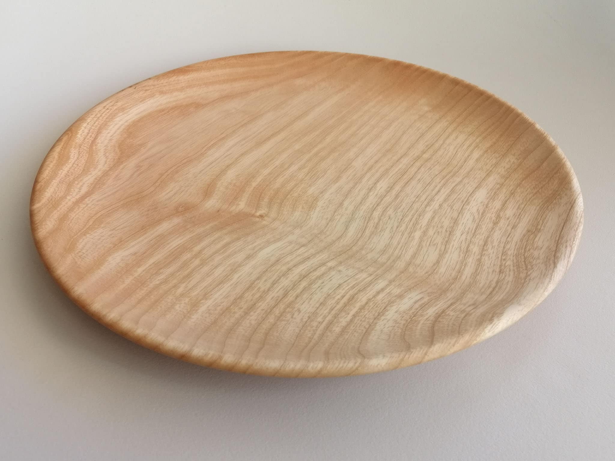 Flat plate. Wooden Plate. Chair made of Ash Wood.
