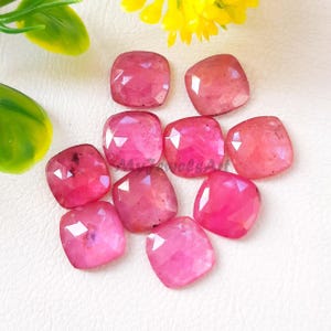 May include: A rustic wooden sign with the text "Welcome to our home" in white lettering. The sign features a distressed finish and a simple, inviting design, perfect for front door decor.