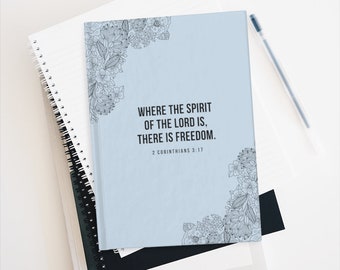 May include: A light blue journal with a floral design and the quote "Where the Spirit of the Lord is, there is freedom."  2 Corinthians 3:17 is printed on the cover.