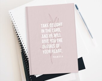 May include: A pink journal with a floral design and the quote "Take delight in the Lord, and he will give you the desires of your heart."  Psalm 37:4