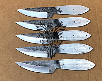 May include: Five unfinished knife blades with a hammered finish. The blades are arranged in a row, with the tips pointing to the right. The blades are made of metal and have a silver color.
