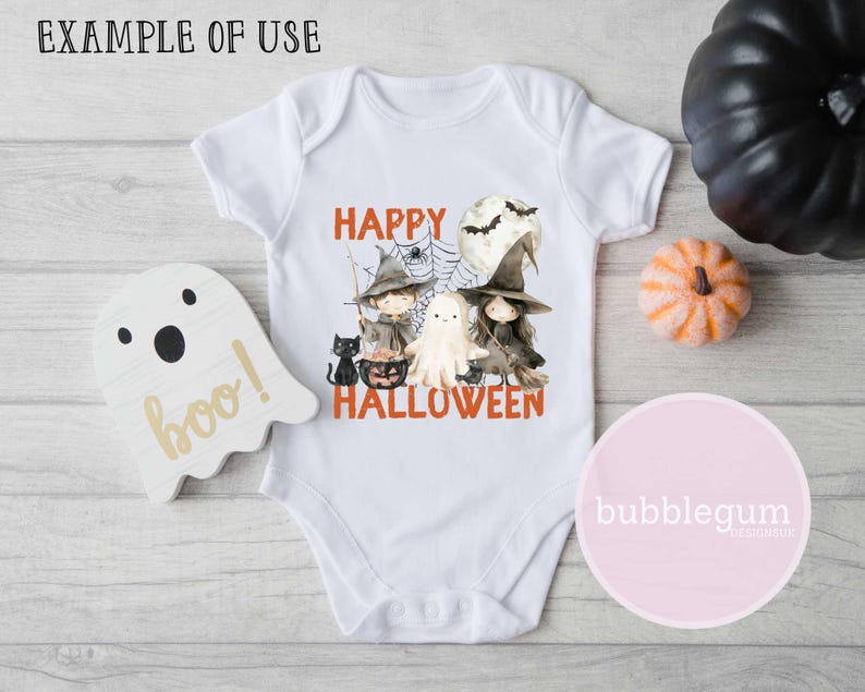 May include: White baby onesie with a graphic of three witches and a ghost. The text "Happy Halloween" is printed in orange below the graphic.