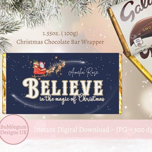 May include: A blue and gold Christmas chocolate bar wrapper with a Santa Claus illustration and the text "Believe in the magic of Christmas".