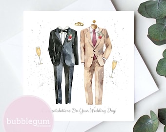 May include: A wedding card with a watercolor illustration of two grooms in suits. The card says "Congratulations on your wedding day!"