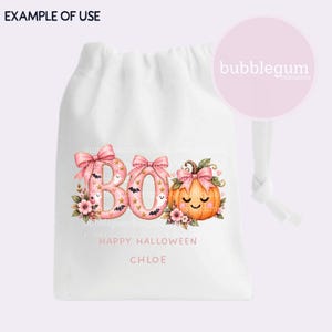 May include: A white drawstring bag featuring a graphic with the text BOO, HAPPY HALLOWEEN, and CHLOE. The design includes pink letters decorated with bows, small ghosts, bats, and stars, alongside a smiling orange pumpkin with a pink bow.