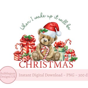May include: A watercolour illustration of a teddy bear wearing a Santa hat and holding a candy cane. The bear is surrounded by wrapped presents with red and green ribbons. The text "When I wake up it will be CHRISTMAS" is written in green lettering around the bear and presents.