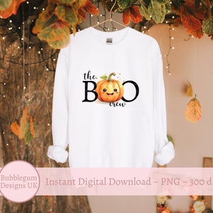 May include: White long-sleeve sweatshirt with the text "the BOO crew" and a cartoon pumpkin with a smiling face.