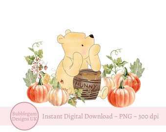 May include: A cartoon bear wearing a yellow shirt sits next to a honey pot labeled "Hunny". The bear is surrounded by pumpkins and fall foliage.