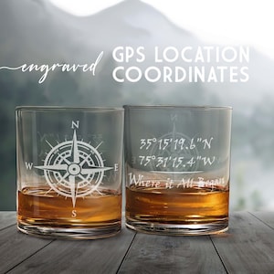 May include: Two clear glass tumblers with engraved compass designs and GPS coordinates. The text on the glasses reads "GPS Location Coordinates" and "Where it All Began".