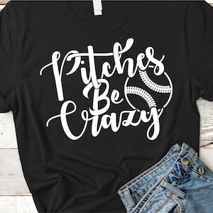 May include: Black t-shirt with the phrase "Pitches Be Crazy" in white script, accompanied by a baseball graphic. The shirt is paired with denim jeans.