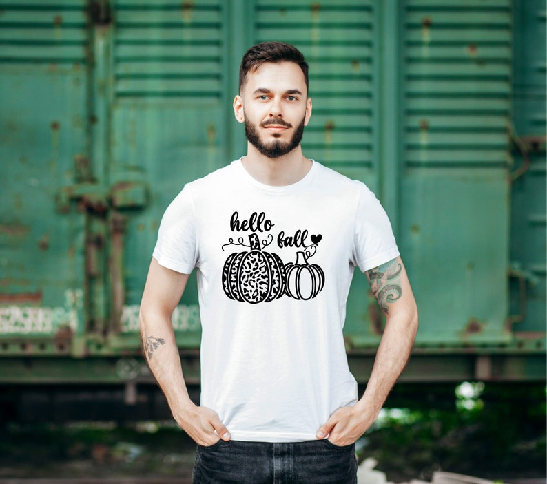 May include: White t-shirt with a black graphic of two pumpkins and the text "hello fall" with a heart.