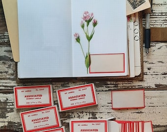 Associated white and red gummed labels; stickers
