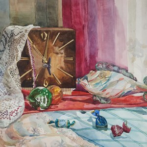 May include: A watercolor painting of a still life with a clock, a fish, and Christmas ornaments. The clock is brown with gold hands and a white face. The fish is white with blue and red stripes. The ornaments are green and gold. The background is a red and white tablecloth.
