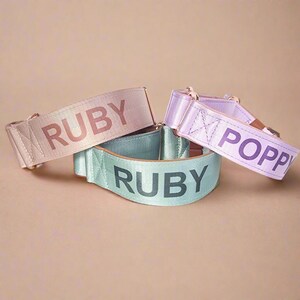 three colorful straps with the name "Ruby" printed on them.