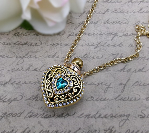 Perfume/Love Potion Bottle Gold filigree Heart Pendant with Blue Heart-Shaped Gemstone on Gold Chain Necklace
