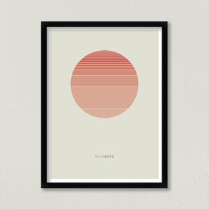 Pode incluir: Uma impress&atilde;o emoldurada com um design minimalista que apresenta um c&iacute;rculo vermelho e rosa com linhas horizontais, sobre um fundo bege claro. O texto "RED SHIFT" est&aacute; impresso abaixo do c&iacute;rculo.